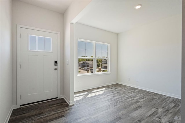 foyer with dark hardwood / wood-style floors