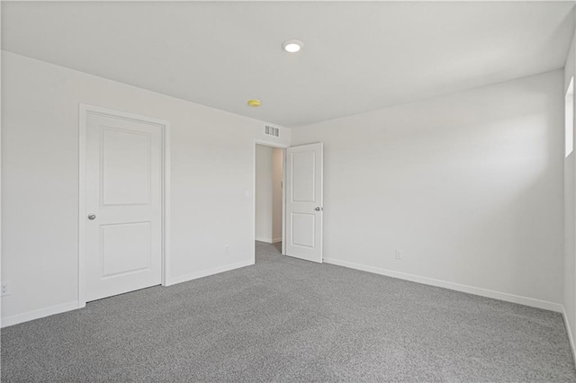 unfurnished room with carpet floors