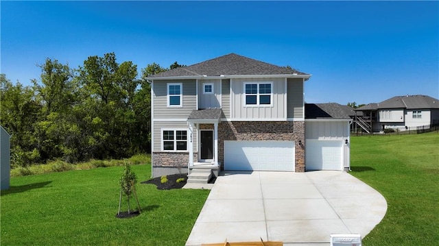 view of front of property with a front lawn and a garage