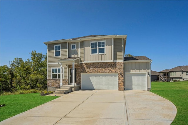 view of front of property with a front yard and a garage