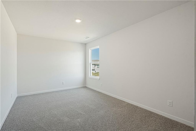 spare room featuring carpet floors