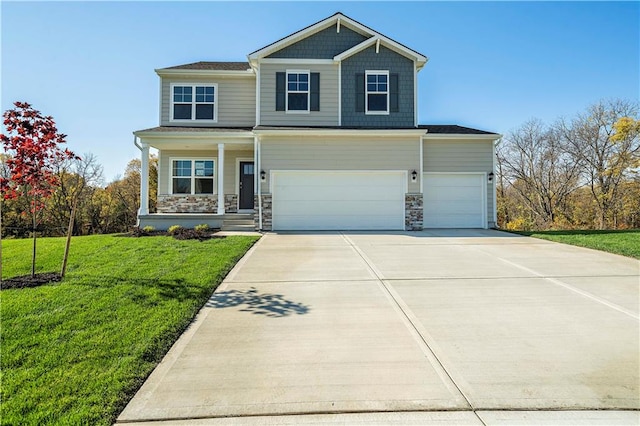 view of front of home with a front yard, a porch, and a garage