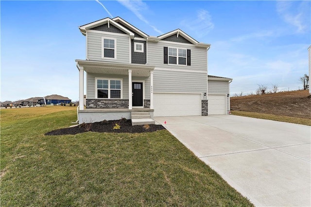 view of front of home featuring a garage and a front lawn