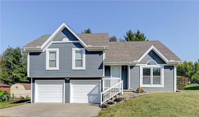 view of front of home featuring a front lawn and a garage