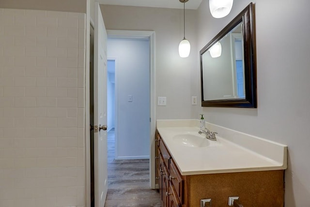 bathroom featuring hardwood / wood-style flooring and vanity