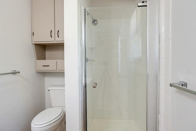 bathroom with walk in shower and toilet