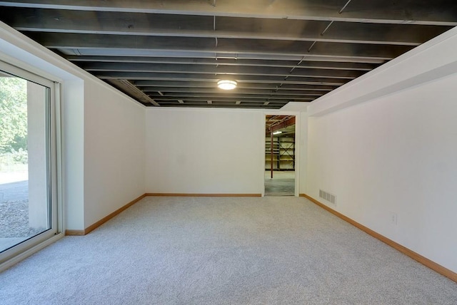 basement featuring carpet flooring