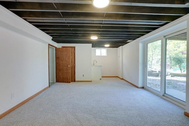 basement with light colored carpet