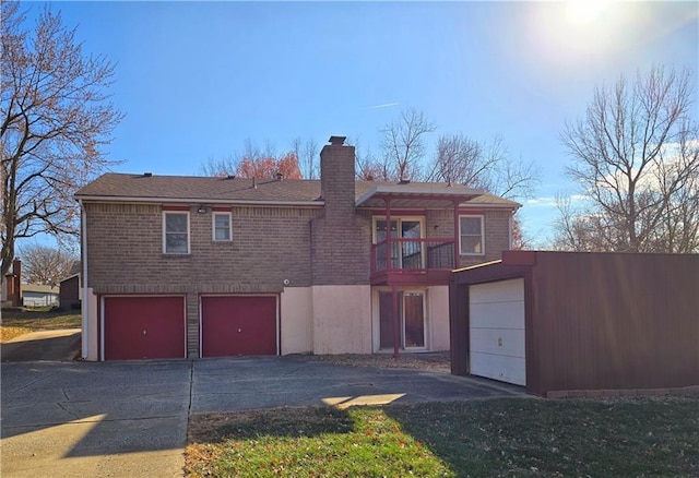 rear view of property featuring a balcony