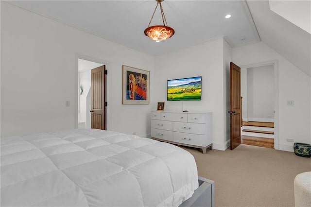 bedroom featuring vaulted ceiling and carpet floors