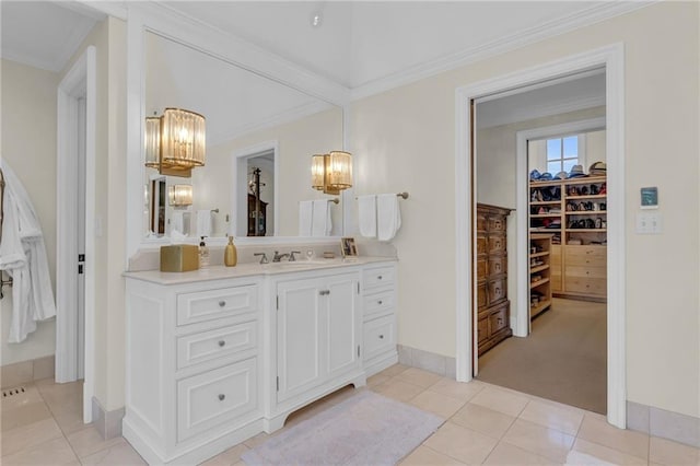 bathroom featuring vanity, crown molding, and tile patterned flooring