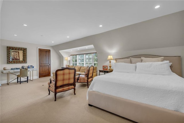 bedroom with light colored carpet and vaulted ceiling