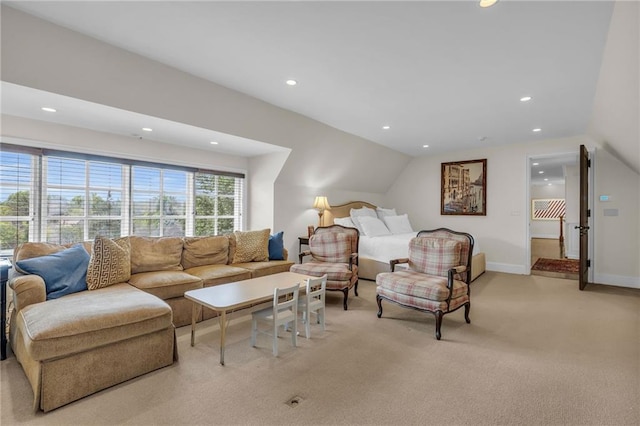 carpeted living room featuring lofted ceiling