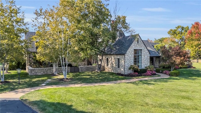 view of side of property with a lawn