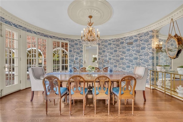 dining room featuring hardwood / wood-style flooring and a chandelier