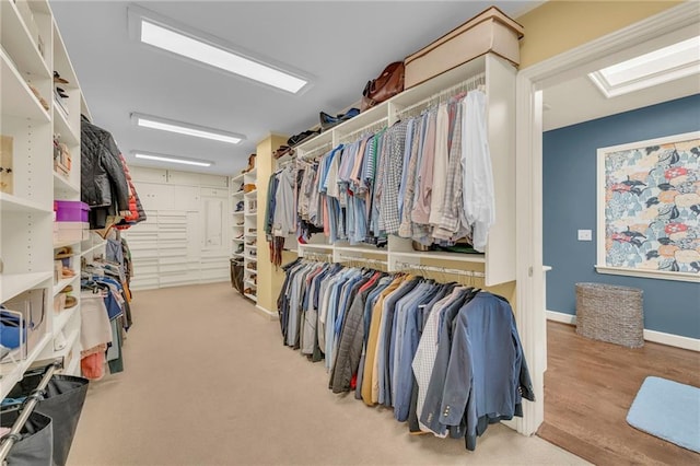 spacious closet with light hardwood / wood-style floors