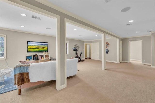 carpeted living room with ornamental molding