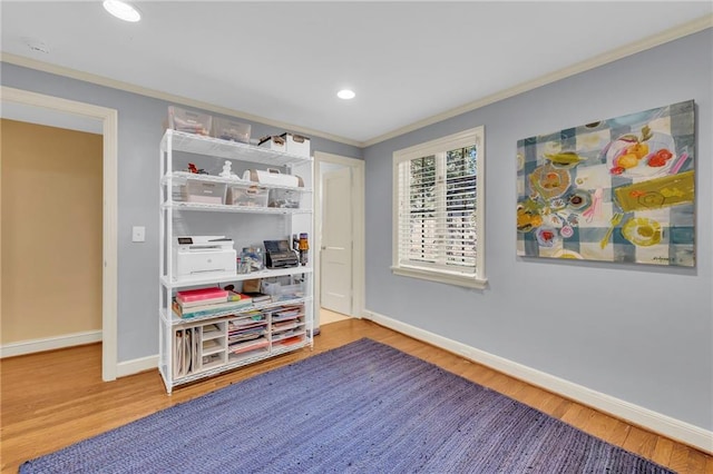 recreation room featuring crown molding and wood-type flooring