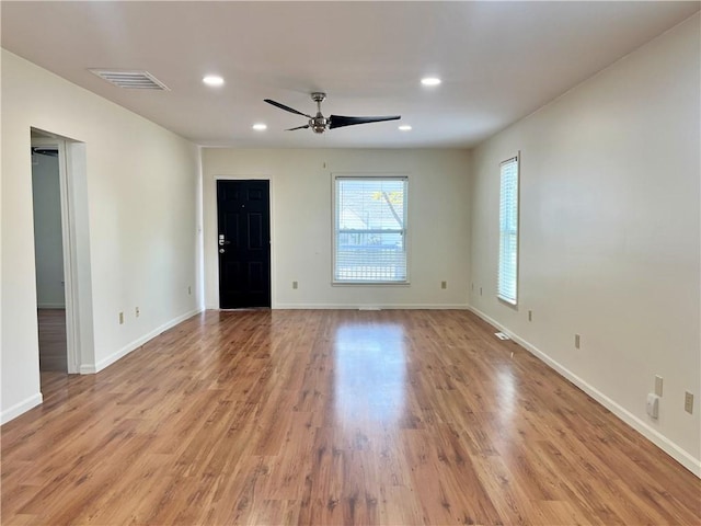 spare room with ceiling fan and light hardwood / wood-style floors