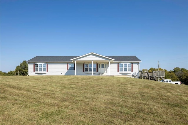 ranch-style home featuring a front yard