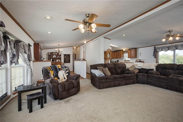 carpeted living room featuring ceiling fan with notable chandelier, vaulted ceiling, ornamental molding, and a textured ceiling