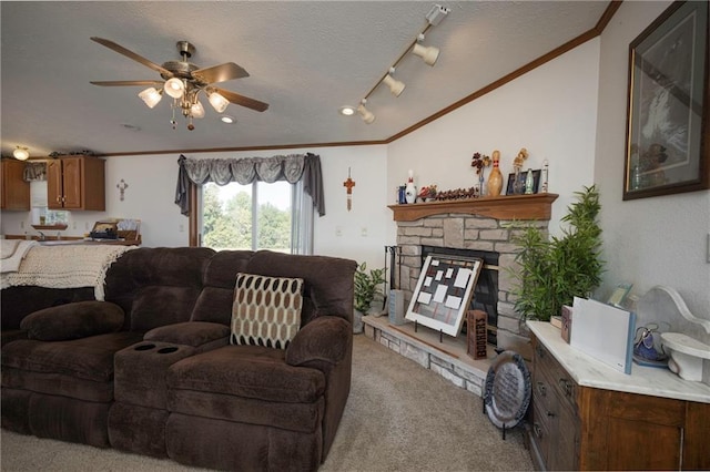 living room with ornamental molding, a fireplace, ceiling fan, and light colored carpet