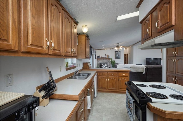 kitchen with ceiling fan, lofted ceiling, sink, white appliances, and a textured ceiling