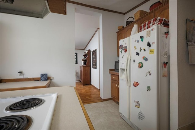 kitchen with light wood-type flooring, crown molding, and white appliances