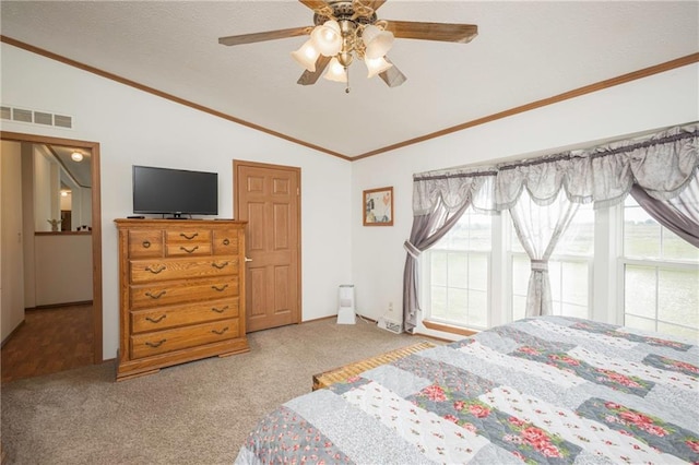 bedroom with lofted ceiling, multiple windows, ceiling fan, and carpet floors