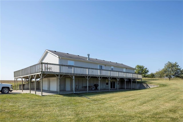 back of property featuring a deck and a lawn