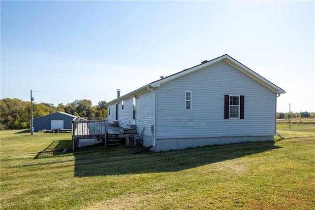 view of property exterior with a lawn and a wooden deck