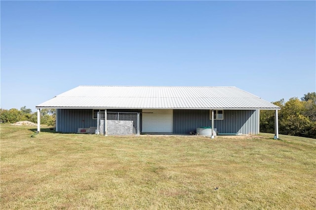 exterior space with a garage and a yard