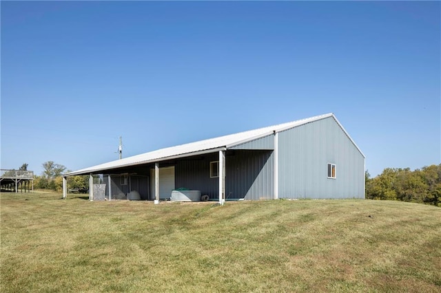 view of outdoor structure featuring a lawn