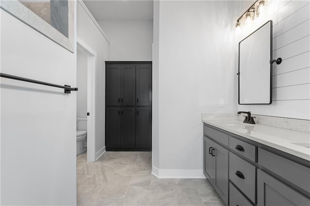 bathroom featuring vanity and toilet