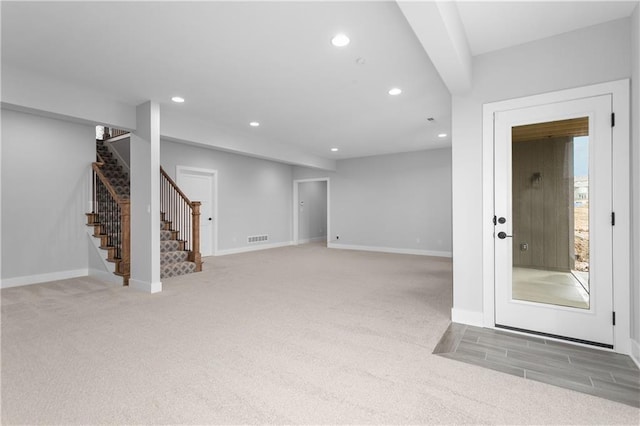 interior space featuring light colored carpet