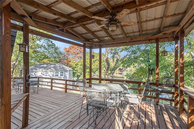 wooden deck featuring a gazebo and ceiling fan