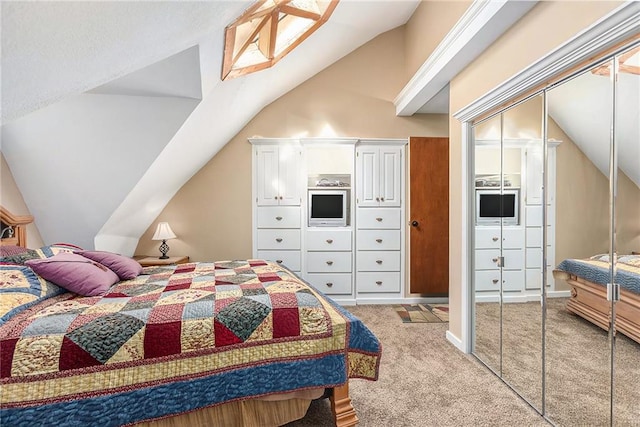 carpeted bedroom with vaulted ceiling