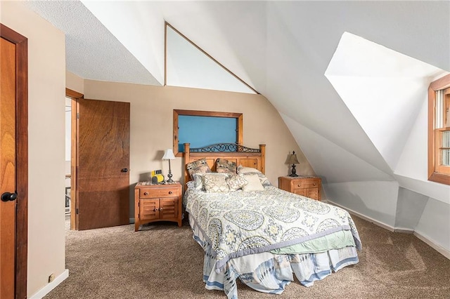 bedroom with lofted ceiling and dark carpet