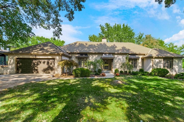 ranch-style home with a front lawn and a garage