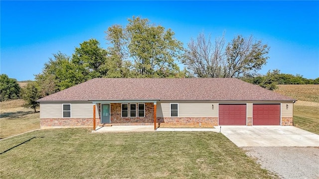 ranch-style home featuring a garage and a front lawn