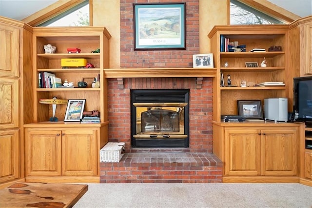 living room featuring vaulted ceiling, a brick fireplace, and light colored carpet