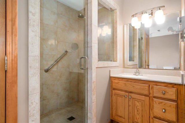 bathroom with vanity and an enclosed shower