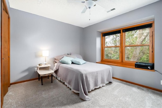 bedroom featuring a closet, carpet floors, and ceiling fan