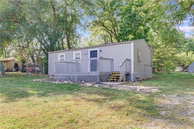 view of outbuilding with a lawn