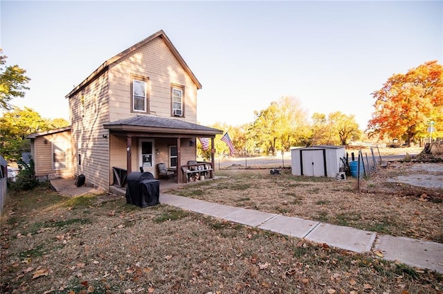 929 N 7th St, Atchison, KS 66002 - back of property with a storage unit, an outbuilding, and fence