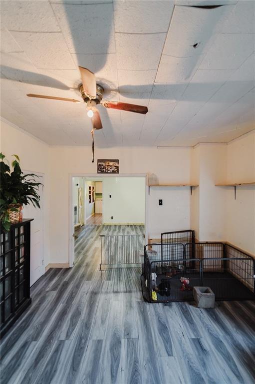929 N 7th St, Atchison, KS 66002 - living area with wood finished floors and a ceiling fan