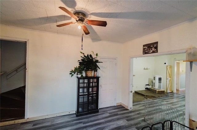 929 N 7th St, Atchison, KS 66002 - empty room with wood finished floors, a ceiling fan, and ornamental molding