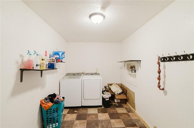 929 N 7th St, Atchison, KS 66002 - clothes washing area with washer and dryer, a textured ceiling, and stone finish floors