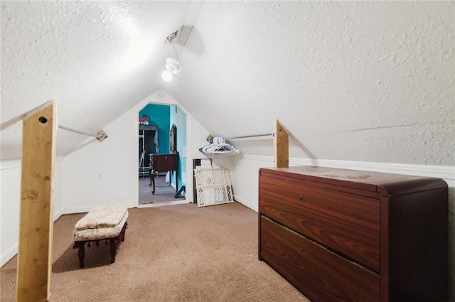 929 N 7th St, Atchison, KS 66002 - bedroom with vaulted ceiling, carpet flooring, and a textured ceiling