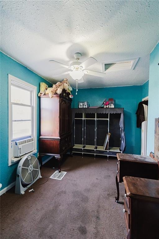 929 N 7th St, Atchison, KS 66002 - bedroom with a textured ceiling, cooling unit, carpet flooring, and ceiling fan